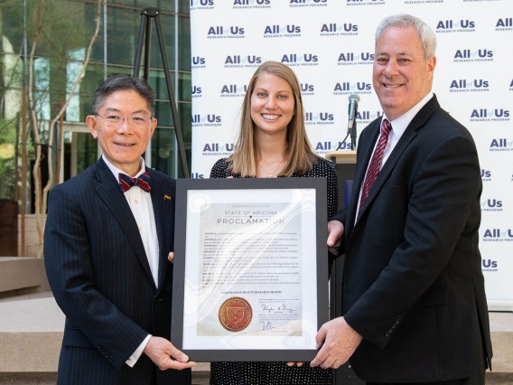 (From left) Barry Wong, JD, director of the Governor’s Office of Equal Opportunity, presents the governor’s proclamation declaring March “Arizonans in Health Research Month” to Jennifer Craig-Muller, director of All of Us UArizona-Banner, and Eric Reiman, MD, chief executive director of Banner Research and principal investigator for All of Us UArizona-Banner.