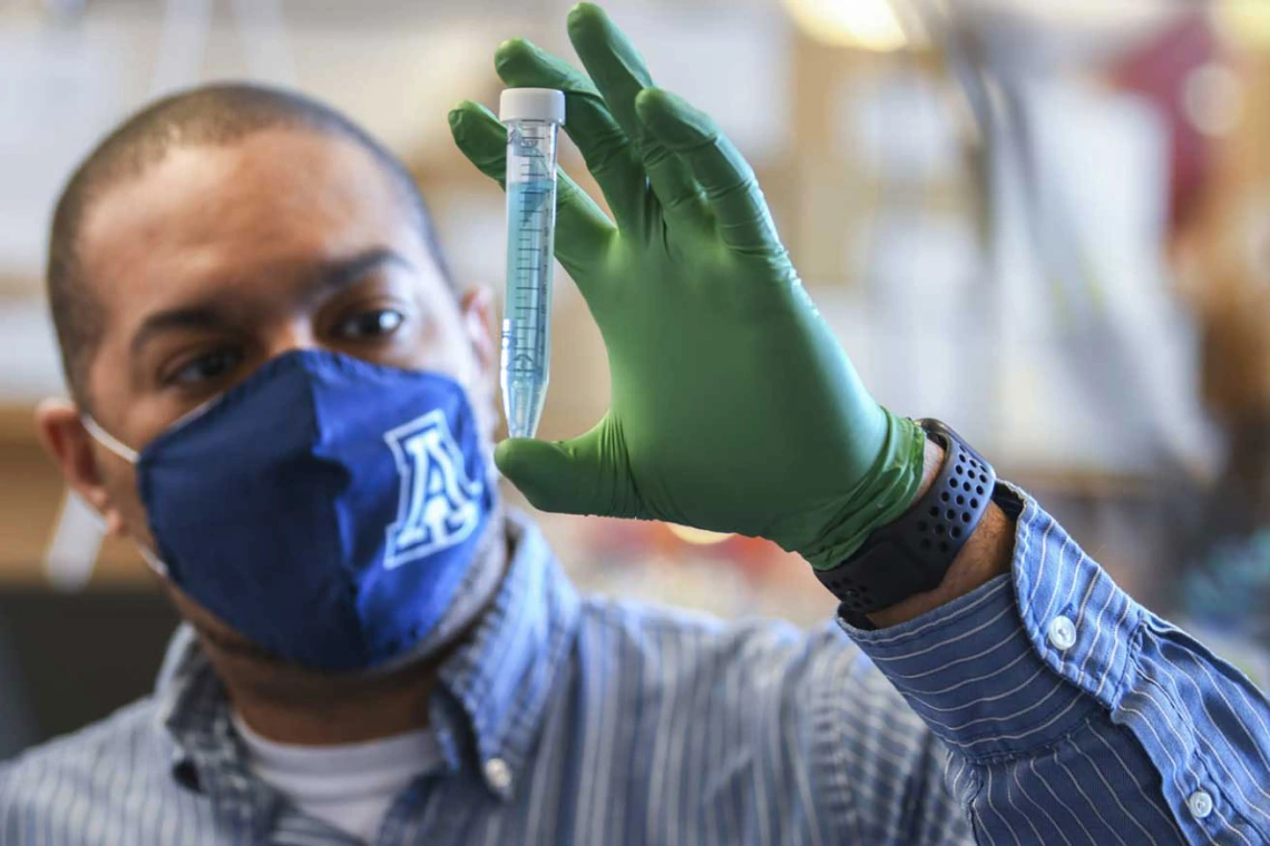 Researcher examining test-tube