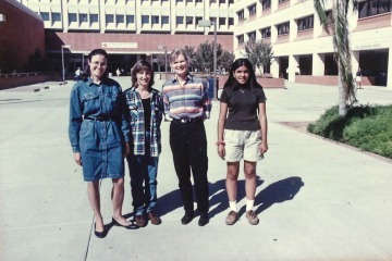 1993 photo of Dr. Shroff as a 14-year-old standing with three other women outside a big building. 