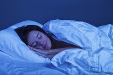 woman sleeping peacefully in bed at night