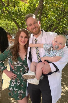 Christian Suyat (middle) with his partner, Kelsey, and their 1-year old son, Kellen, at the R. Ken Coit College of Pharmacy White Coat Ceremony. 