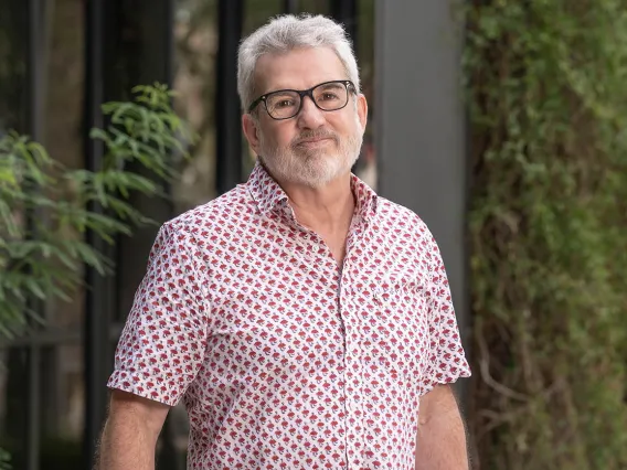 Portrait of a white man with short gray hair and beard.