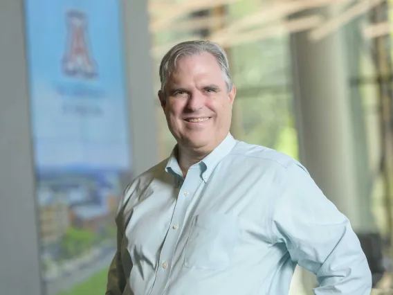 Outdoor portrait of Justin Starren, MD, PhD, on the grounds of the University of Arizona Health Sciences  