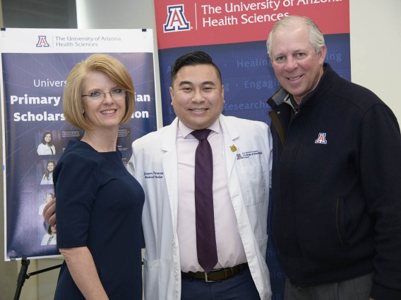 Rep. Heather Carter, Primary Care Physician scholarship recipient Jasper Puracan and University of Arizona President Robert C. Robbins, MD, pose for a photo.