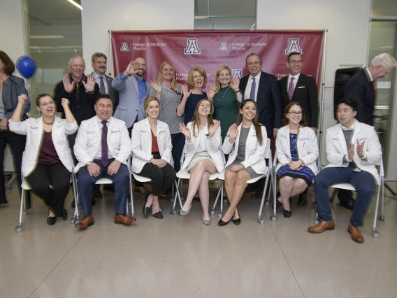 A group photo of Primary Care Physician scholarship recipients, University of Arizona staff and community members.