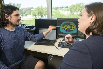 During the summer program, Ferris Saad learned how to identify and analyze different fat and muscle regions on MRI and CT scans while working with Jennifer W. Bea, PhD.