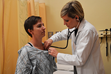 Nurse practitioner examining patient