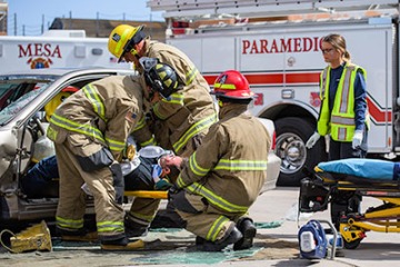Firefighter and paramedic personnel extricate a crash victim during a simulated auto accident. (Photo: Sun Belous/UA College of Medicine - Phoenix)