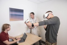 Man using virtual reality headset and controllers